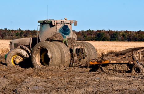 mud encrusted tractor