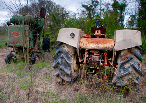 abandoned tractor and combine